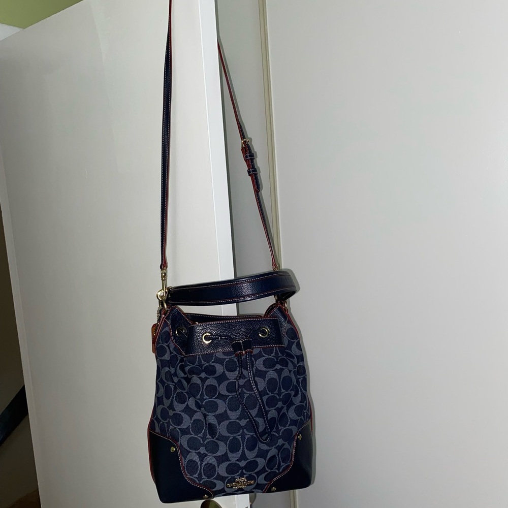 Coach denim bucket bag with crossbody strap and side zip pocket